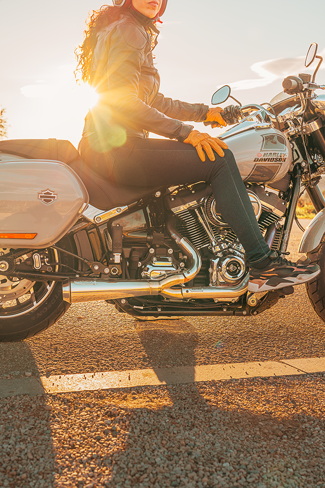 Harley Davidson Softail with Black Duck Tech Fighter exhaust, woman riding, CE approved and lifetime warranty